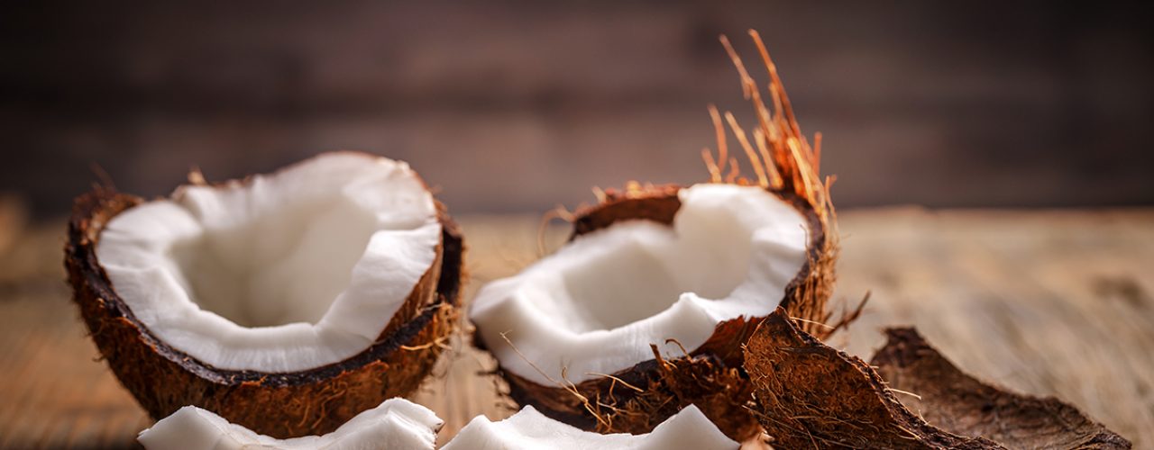 Fruits of coconut on wooden background
