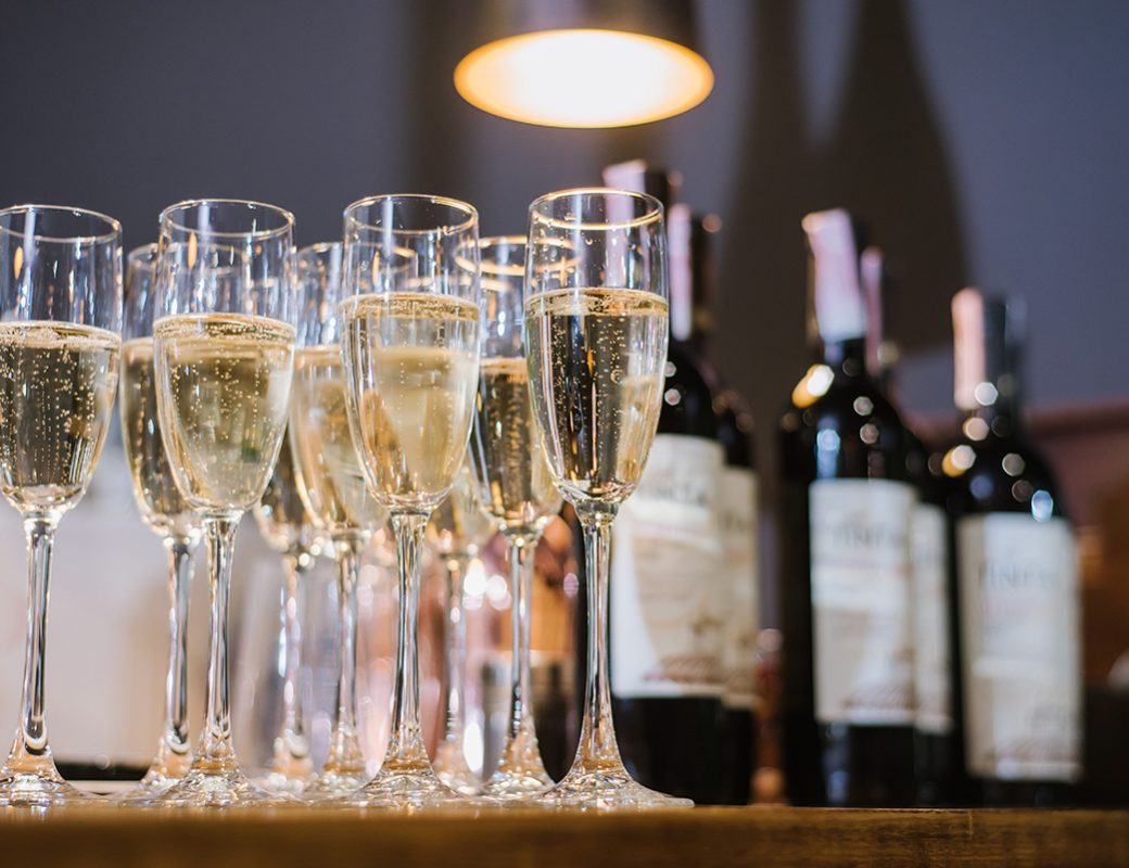 A glasses with champagne on the table at the restaurant. Preparation to celebrate