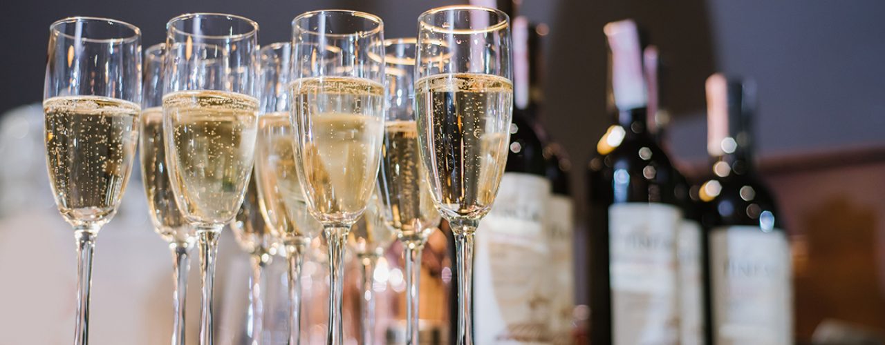 A glasses with champagne on the table at the restaurant. Preparation to celebrate